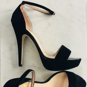 Black velvet platform heels.